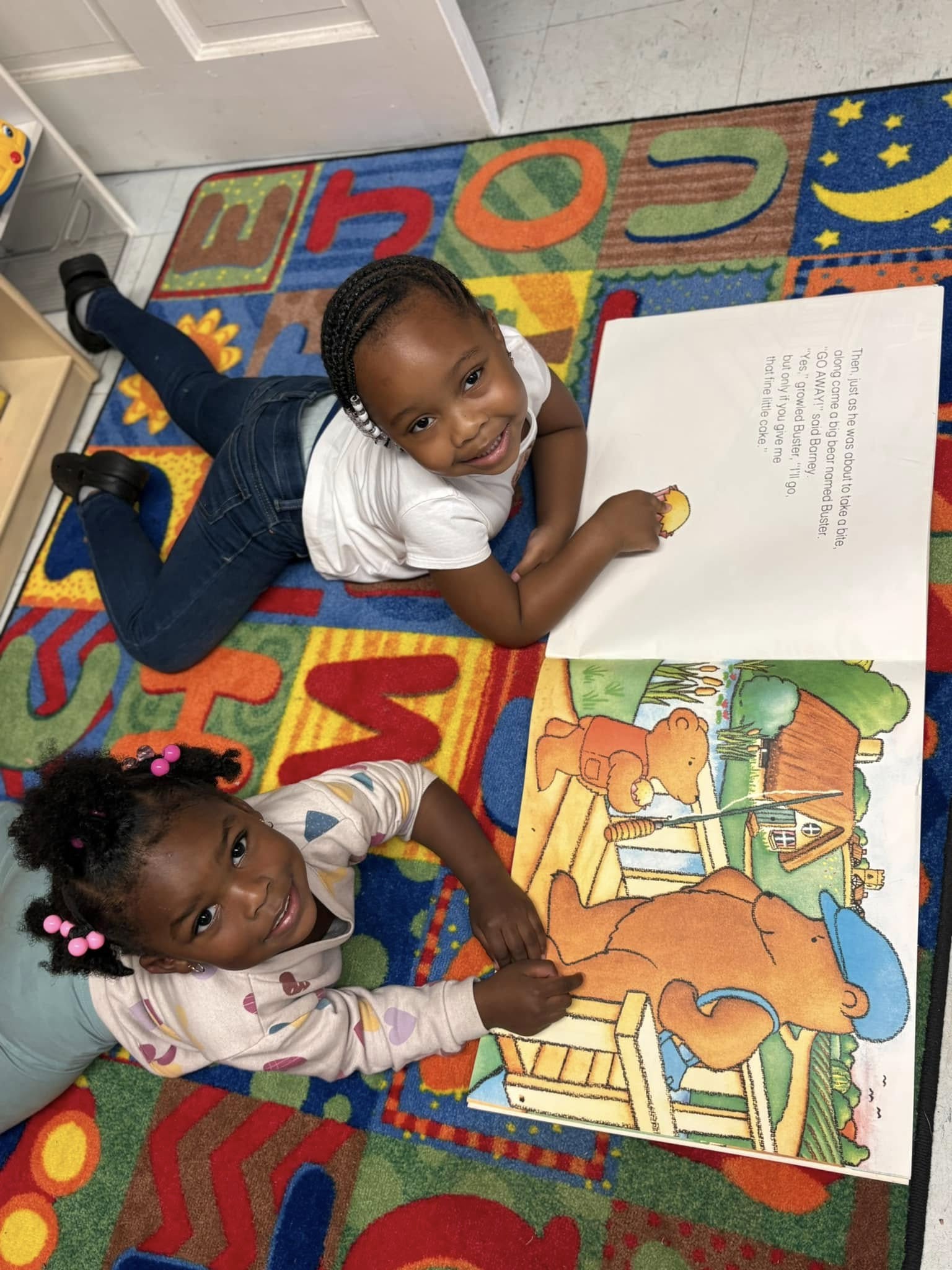 Teacher supporting a child one-on-one at a table